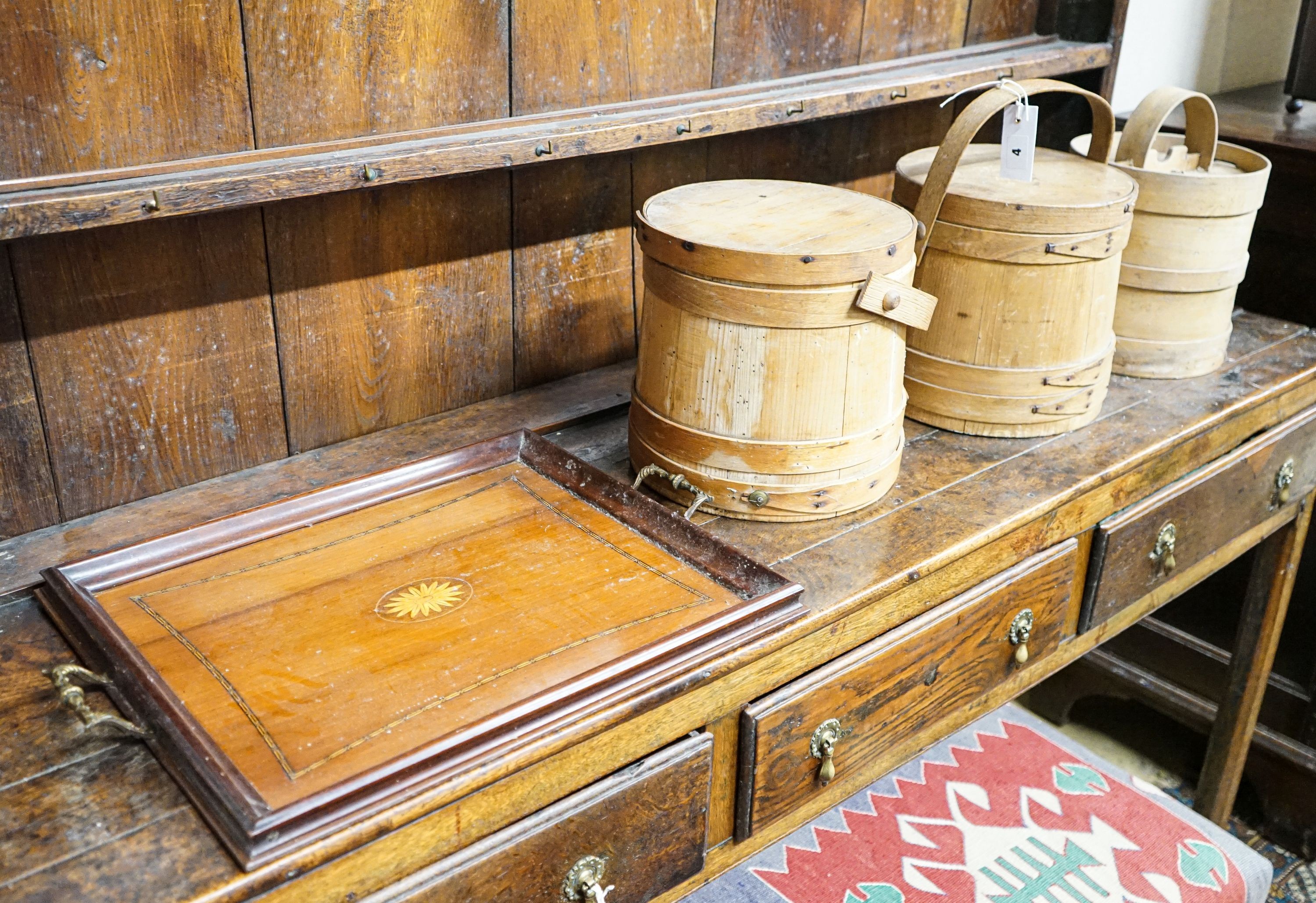 Three wooden butter pails and an Edwardian inlaid walnut tray, width 54cm